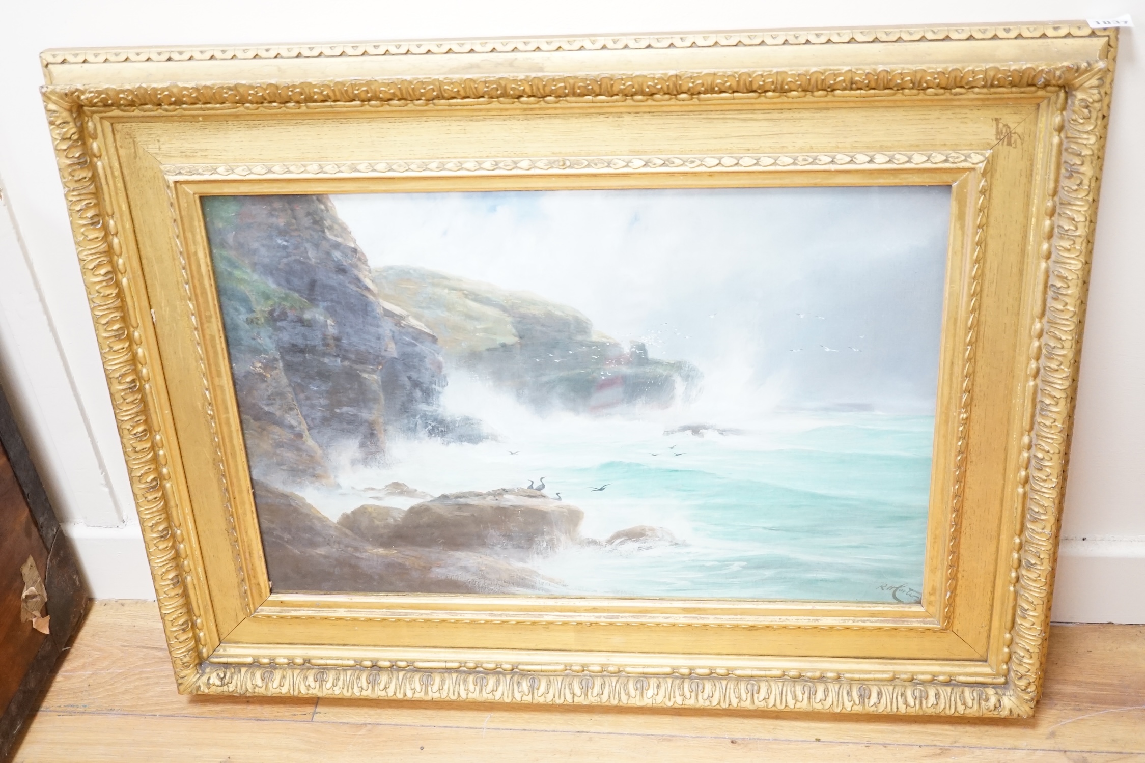 Richard Harry Carter (1839-1911), oil, Seascape with rocky cliffs, signed, 39 x 59cm. Condition - fair
